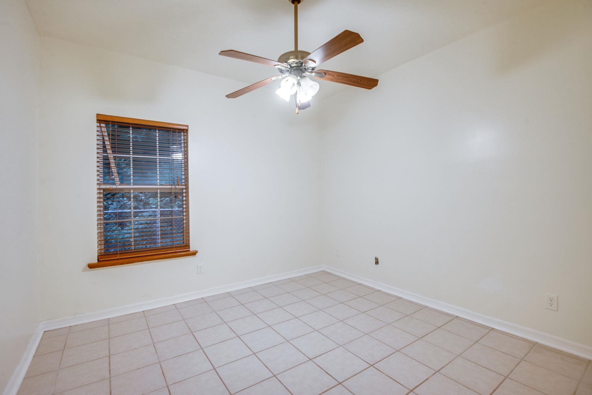 549 Porter Hollow Road Linden, TN 37096 - Photo 15 of 30 Bedroom three downstairs. All bedrooms have ceiling fans.