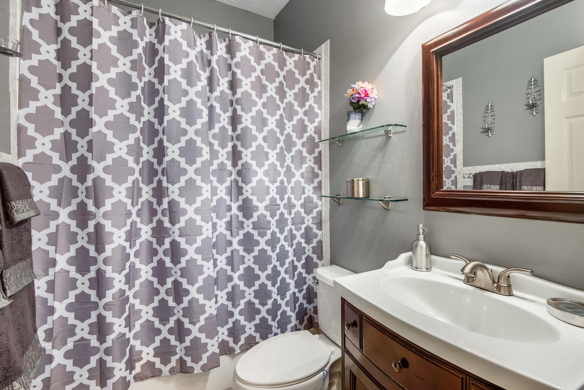 549 Porter Hollow Road Linden, TN 37096 - Photo 16 of 30 Downstairs full bathroom is convenient both to common areas and bedrooms two and three.