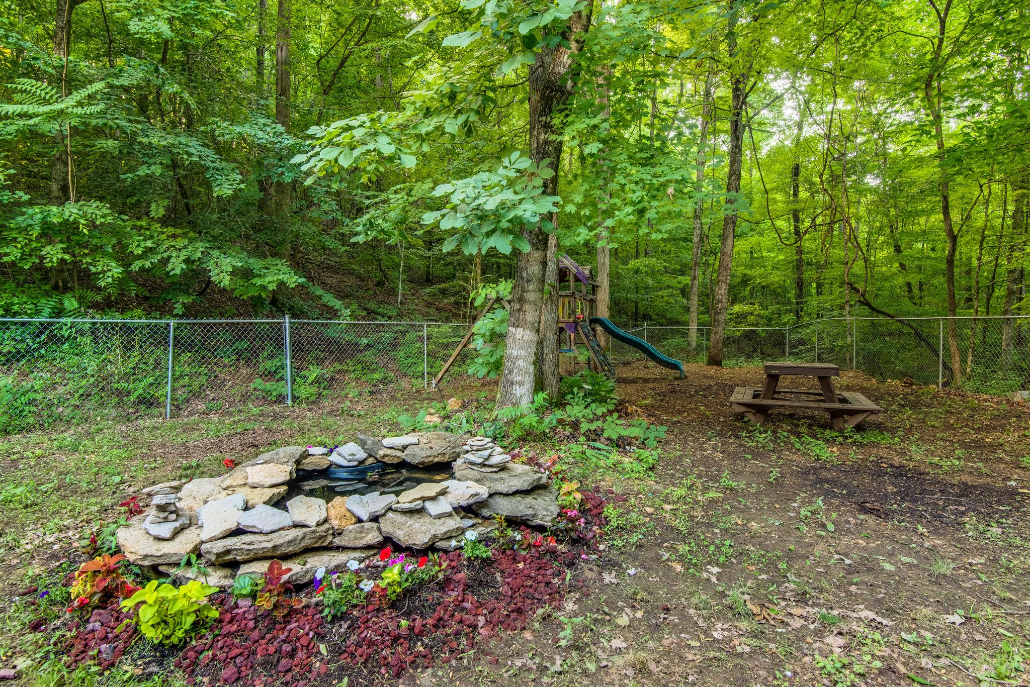 549 Porter Hollow Road Linden, TN 37096 - Photo 27 of 30 Water feature in the back yard adds to the serenity of this unique space.