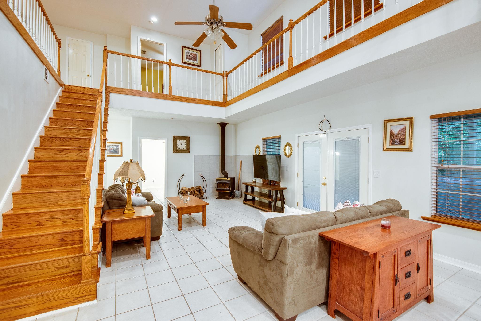 549 Porter Hollow Road Linden, TN 37096 - Photo 9 of 30 Living rooms is open to kitchen dining and upstairs balcony.
