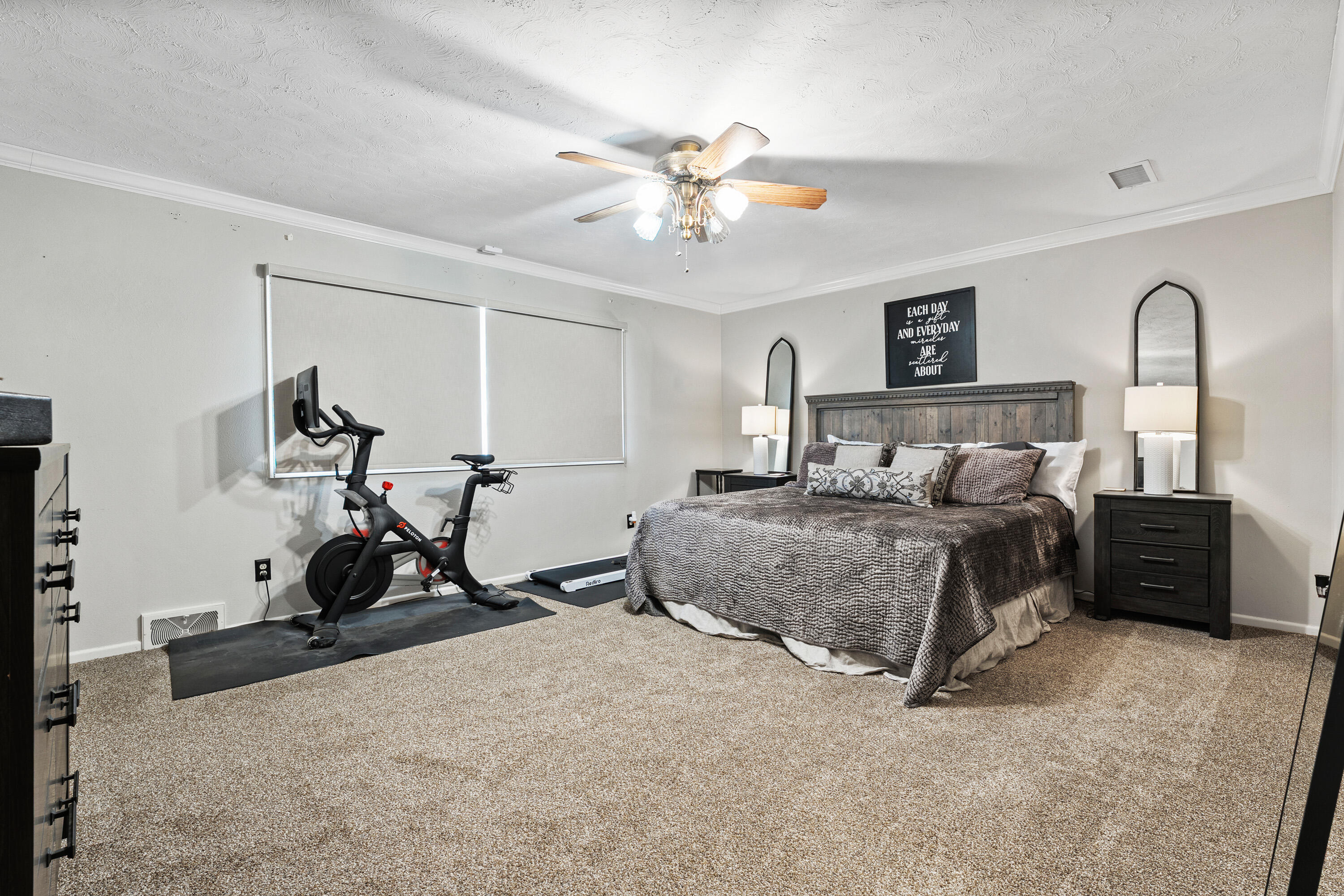 1304 Ave J Ralls, TX 79357 - Photo 18 of 32 a bedroom with a bed and a chandelier