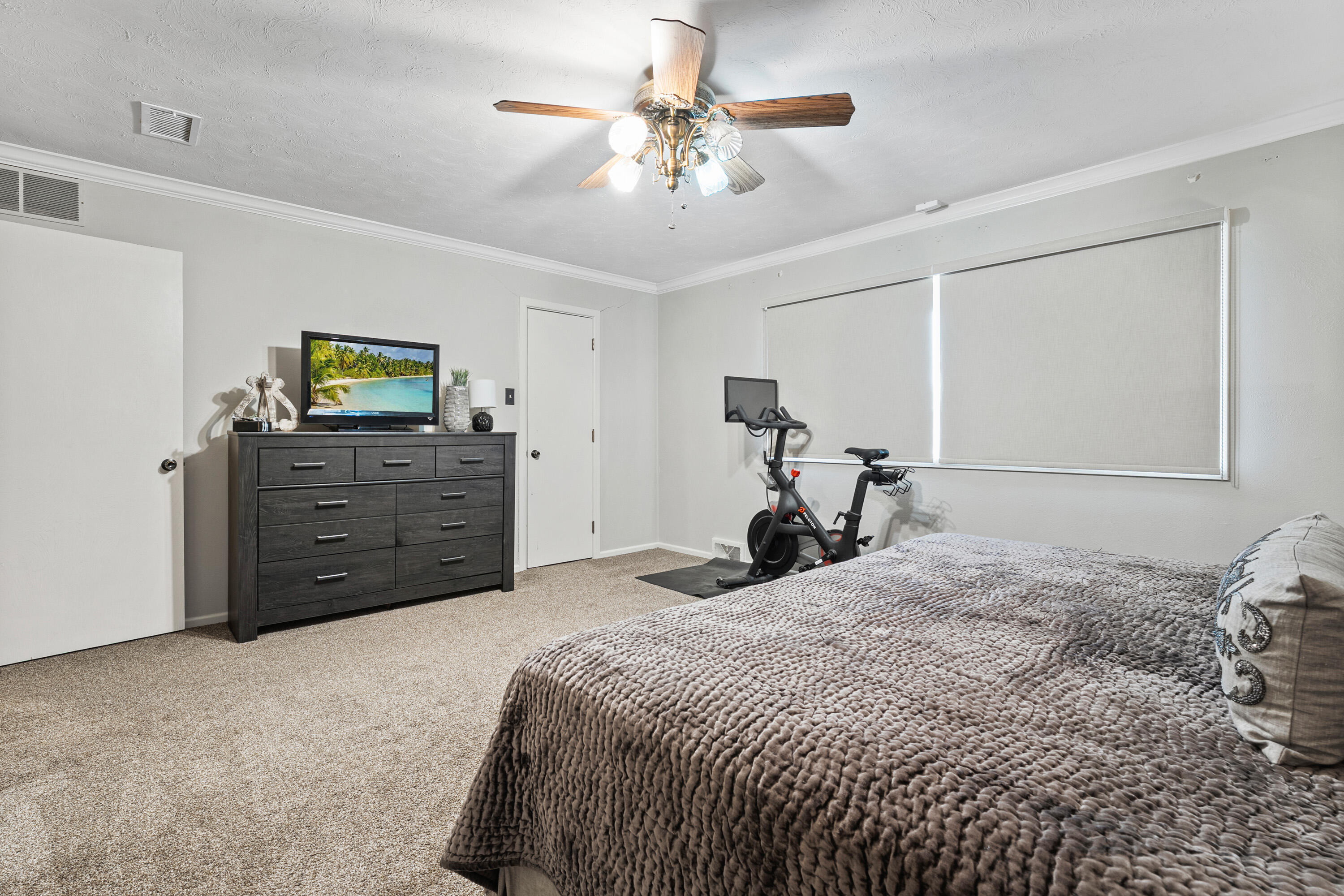 1304 Ave J Ralls, TX 79357 - Photo 19 of 32 a bed room with a bed and a chandelier