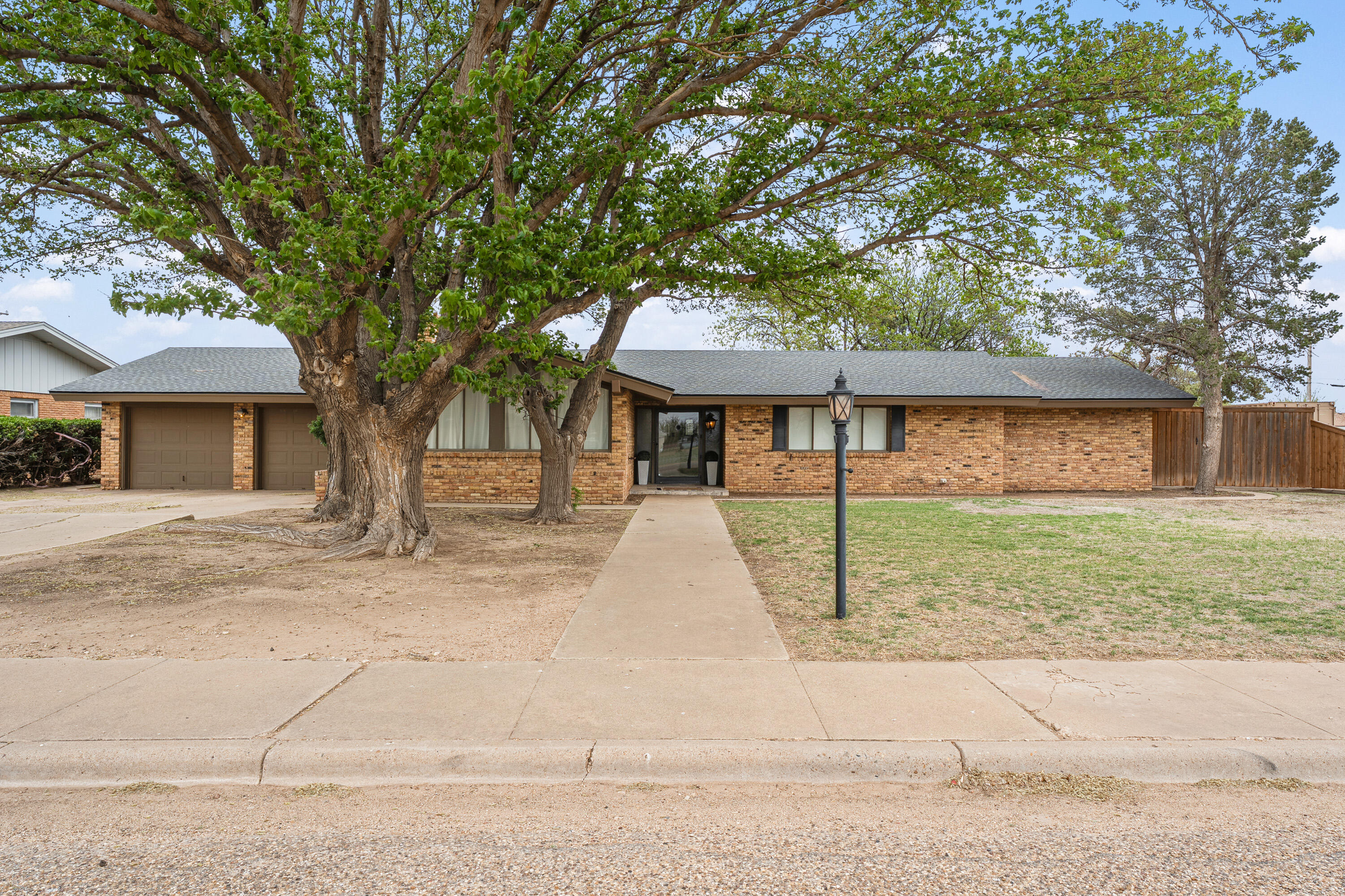 1304 Ave J Ralls, TX 79357 - Photo 2 of 32 a front view of a house with a yard