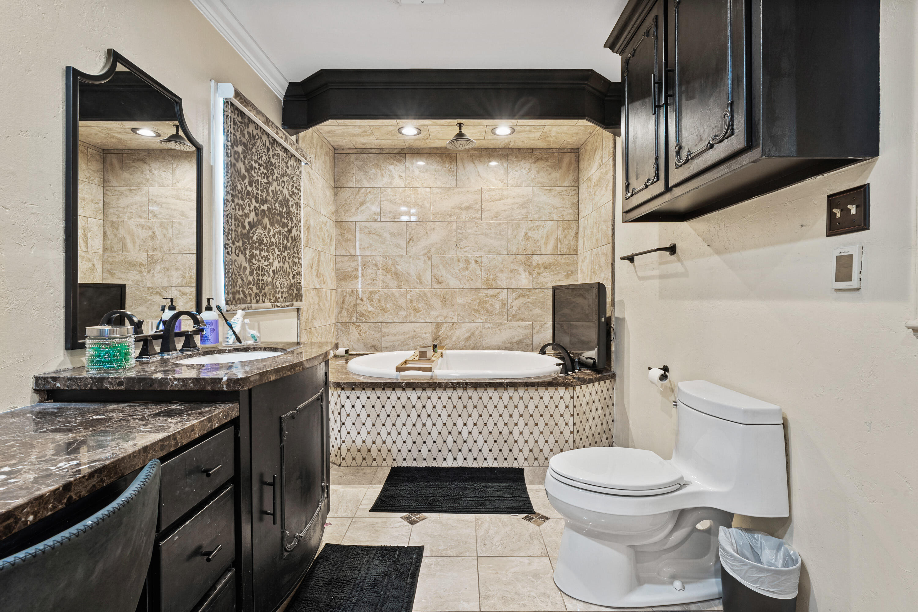 1304 Ave J Ralls, TX 79357 - Photo 25 of 32 a bathroom with a granite countertop sink a toilet and shower