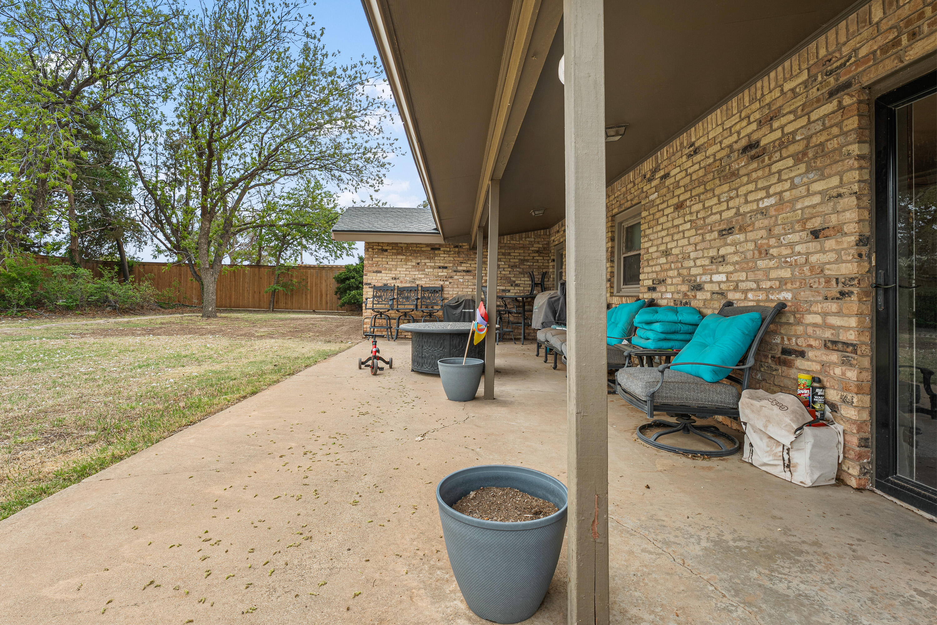1304 Ave J Ralls, TX 79357 - Photo 28 of 32 a view of patio with table and chairs and potted plants