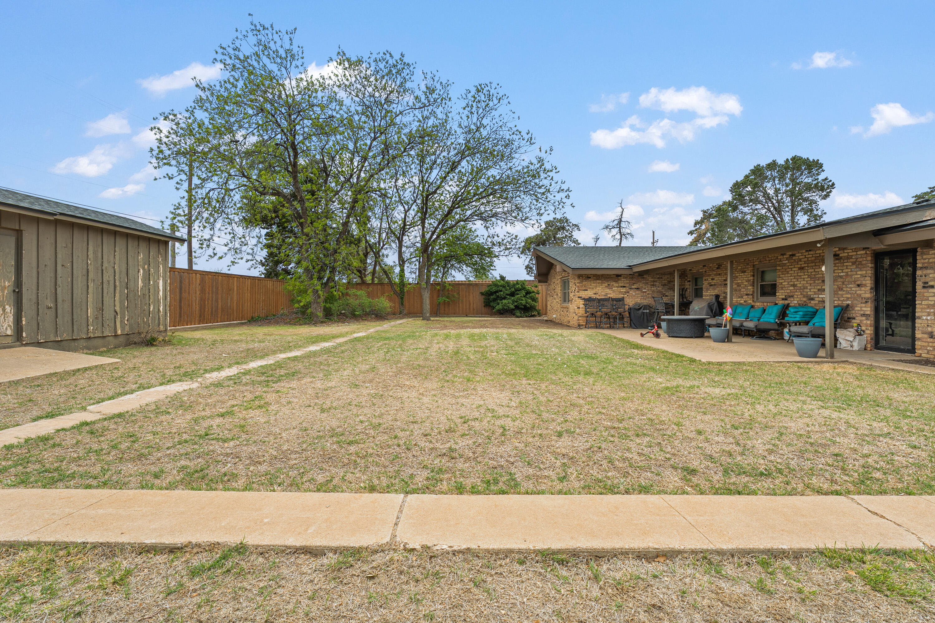 1304 Ave J Ralls, TX 79357 - Photo 29 of 32 a view of swimming pool with outdoor seating and house in the background