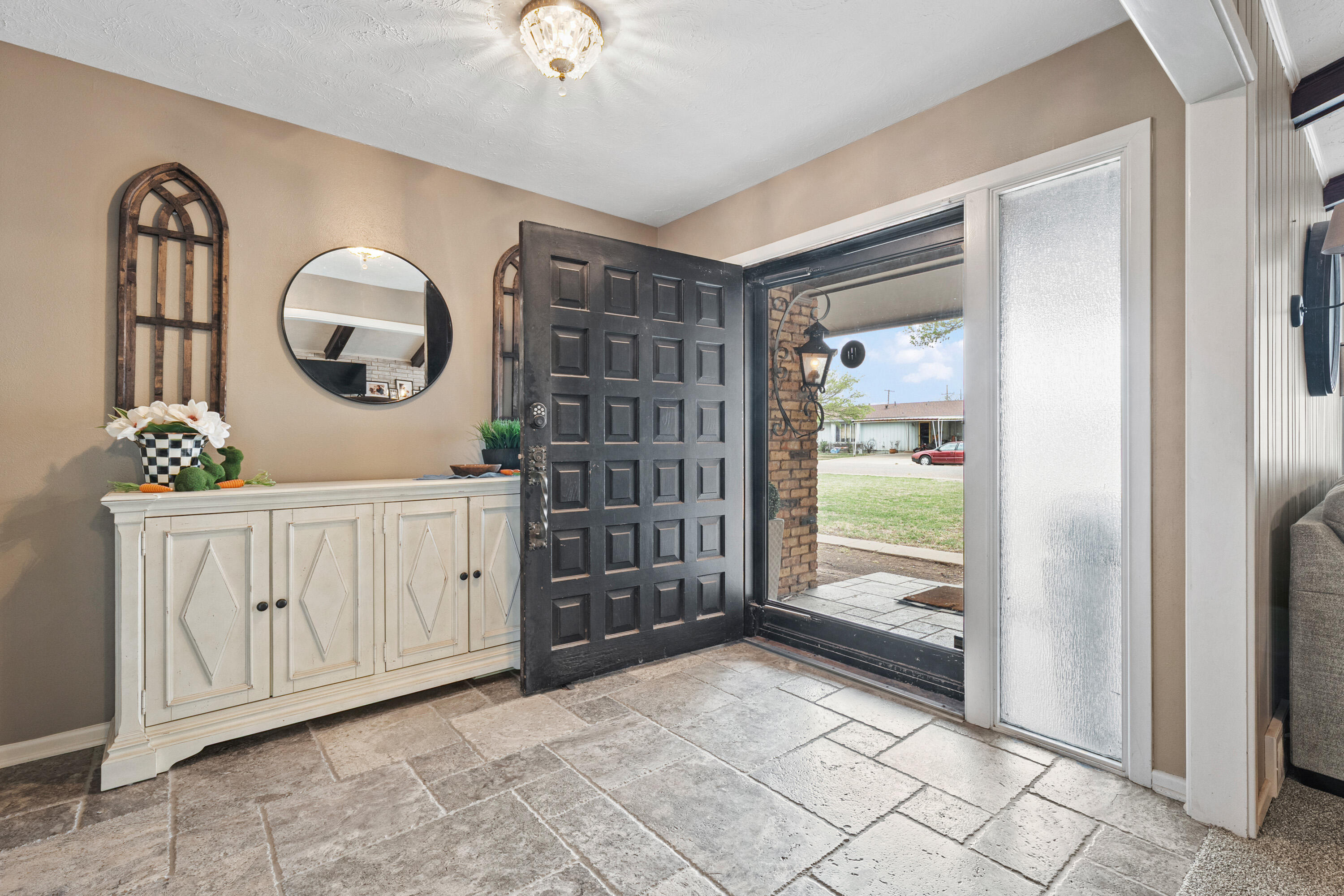1304 Ave J Ralls, TX 79357 - Photo 4 of 32 a view of a hallway with entryway wooden floor and front door
