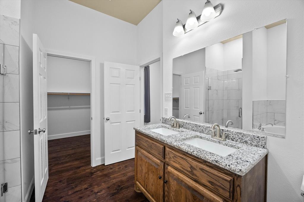 2526 Fox Point Circle Quinlan, TX 75474 - Photo 22 of 35 Master walk in closet opens onto master bath