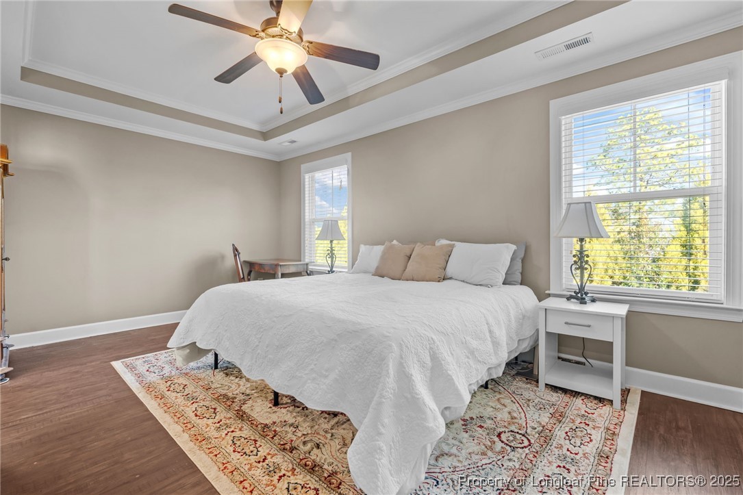 994 Micahs Way North Spring Lake, NC 28390 - Photo 17 of 42 a bedroom with a bed and a window