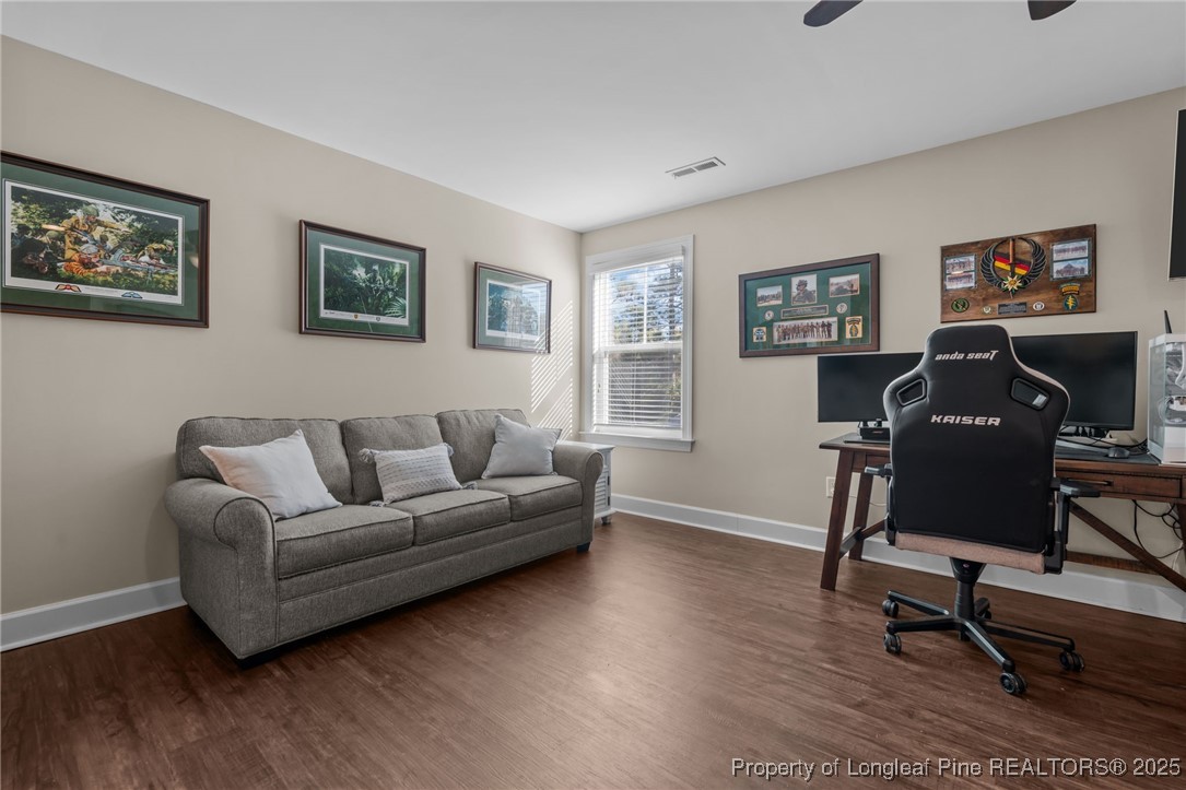 994 Micahs Way North Spring Lake, NC 28390 - Photo 24 of 42 a view of a livingroom with workspace and a couch