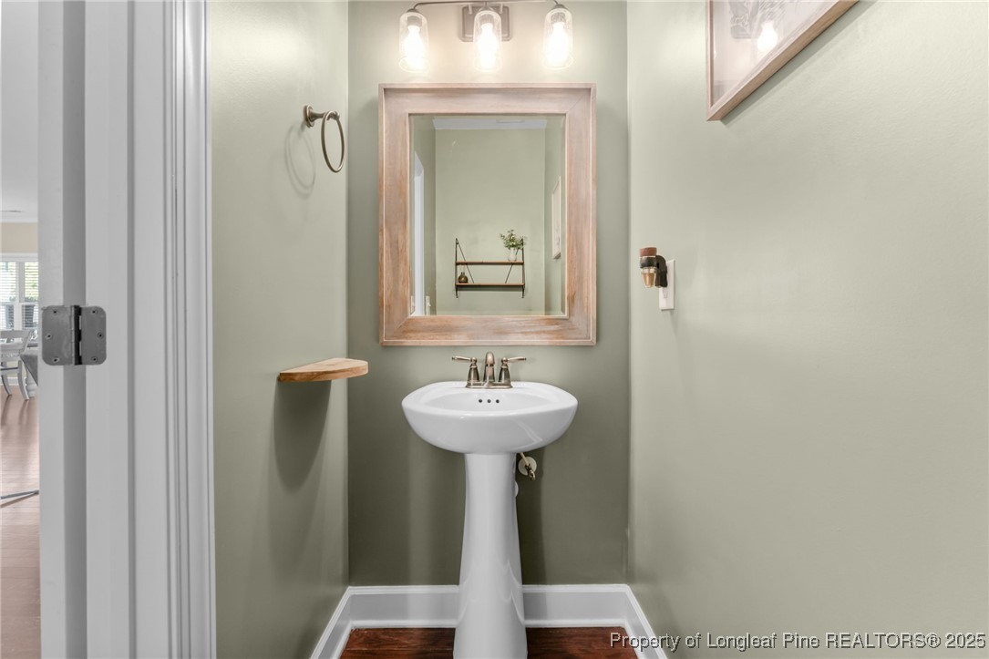 994 Micahs Way North Spring Lake, NC 28390 - Photo 29 of 42 a bathroom with a sink and a mirror