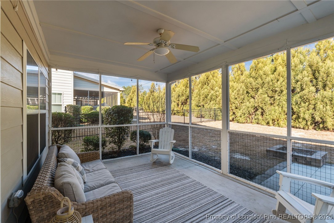 994 Micahs Way North Spring Lake, NC 28390 - Photo 30 of 42 a living room with furniture and a large window