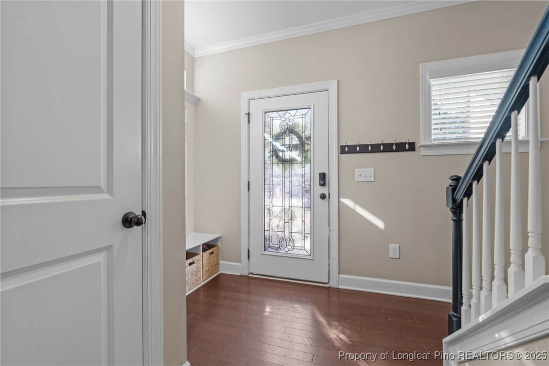 994 Micahs Way North Spring Lake, NC 28390 - Photo 5 of 42 a view of an empty room with wooden floor and a window