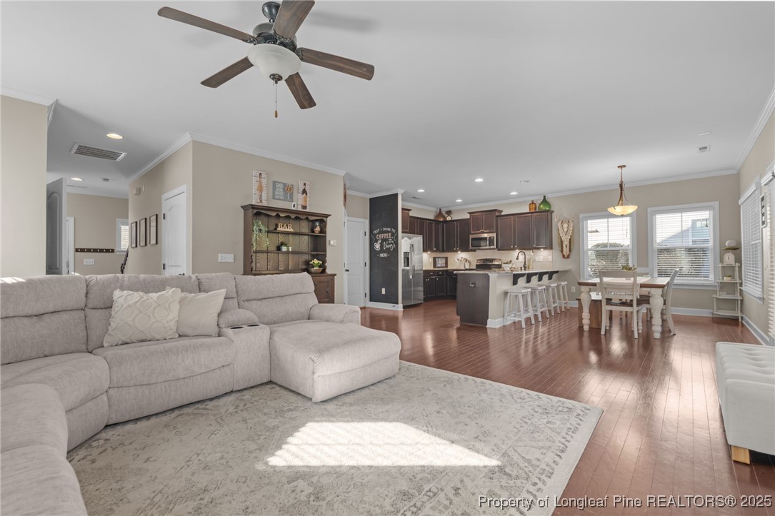 994 Micahs Way North Spring Lake, NC 28390 - Photo 6 of 42 a living room with furniture and a view of kitchen