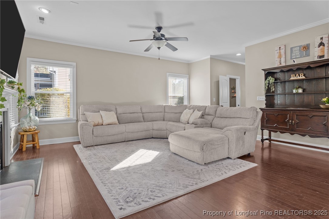 994 Micahs Way North Spring Lake, NC 28390 - Photo 7 of 42 a living room with furniture and a fireplace