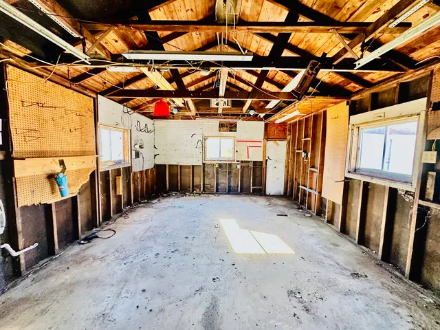 a view of a room with wooden walls