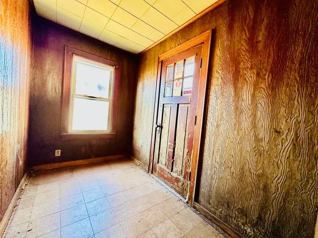 a view of entryway with wooden floor
