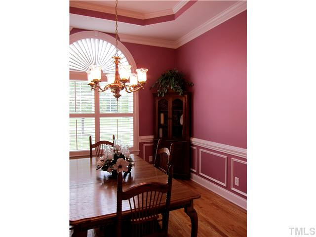 2000 Wheelerbrook Court Raleigh, NC 27603 - Photo 4 of 12 Beautiful Formal Dining Room with Custom Trim Moldings and Paladium Window. Entire First Floor has Plantation Shutters - Wow! Dining Room