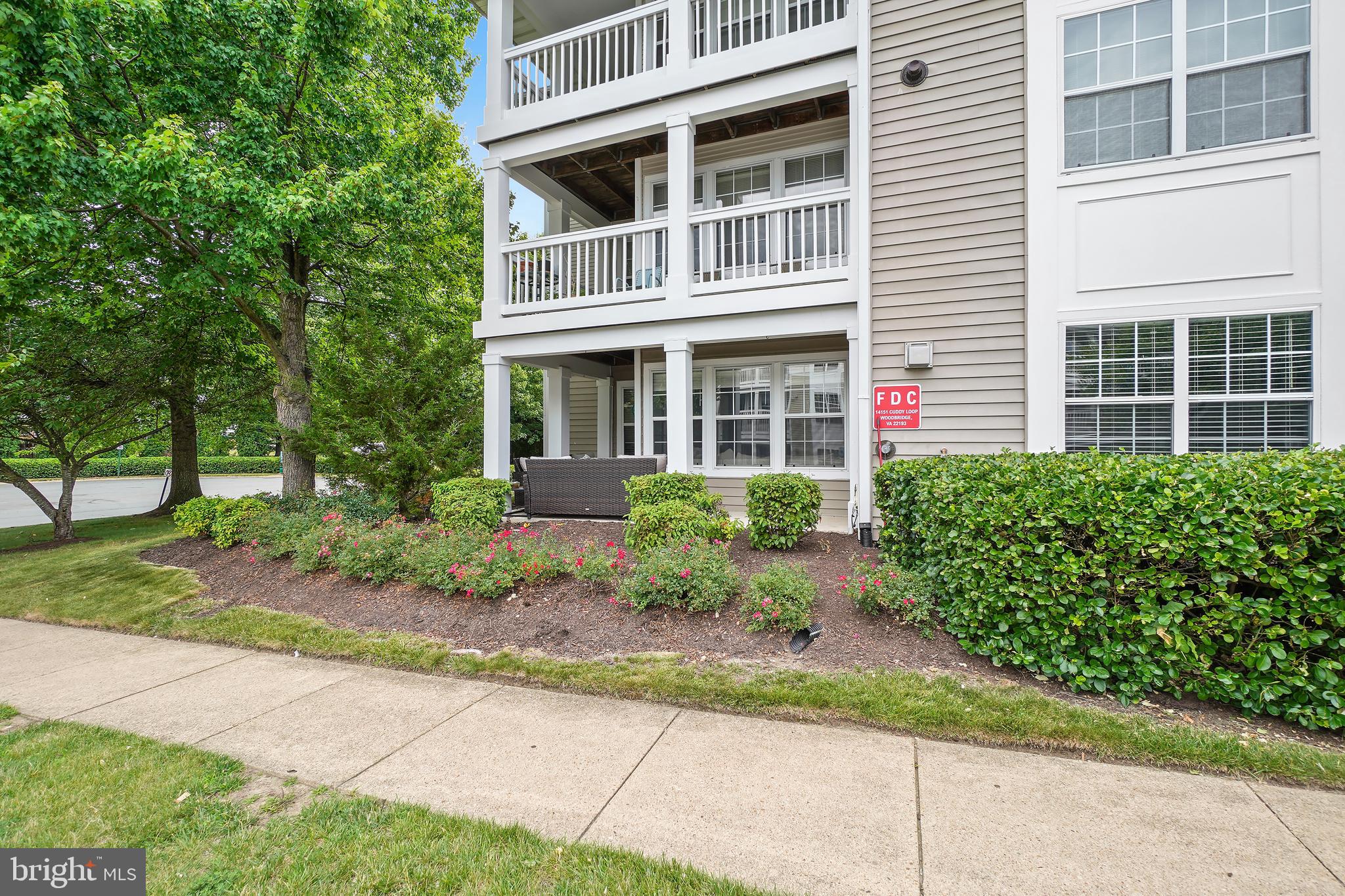 14151 Cuddy Loop, Unit 101 Woodbridge, VA 22193 - Photo 33 of 45 a view of a building with potted plants