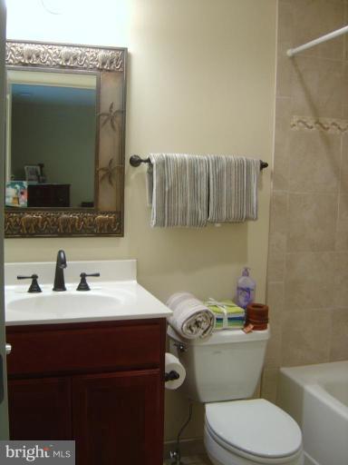 16820 Whites Store Road Boyds, MD 20841 - Photo 19 of 30 a bathroom with a sink toilet and mirror