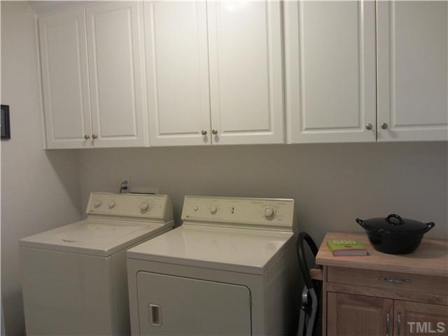 309 Russ Road Smithfield, NC 27577 - Photo 10 of 25 Lots of storage cabinets in laundry room!