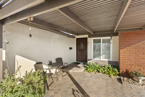 a view of a house with a backyard