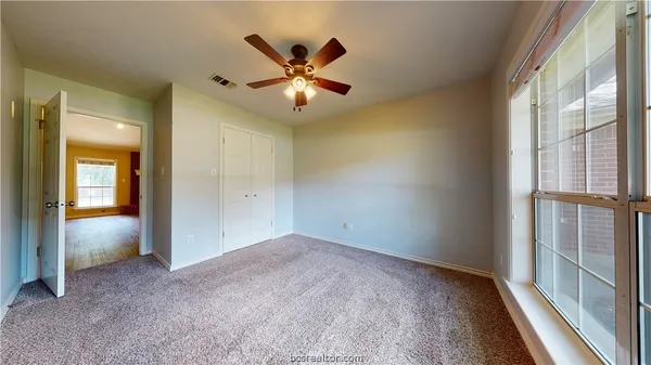 wooden floor in an empty room and a window