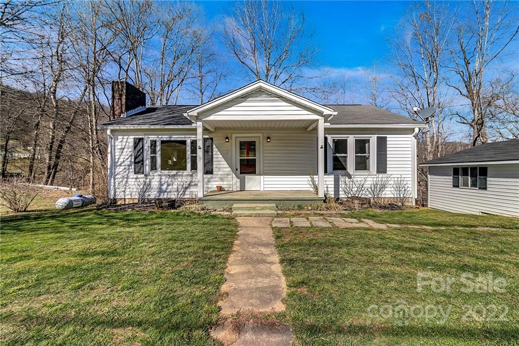 1470 Max Thompson Road Canton, NC 28716 - Photo 1 of 35 a front view of a house with garden