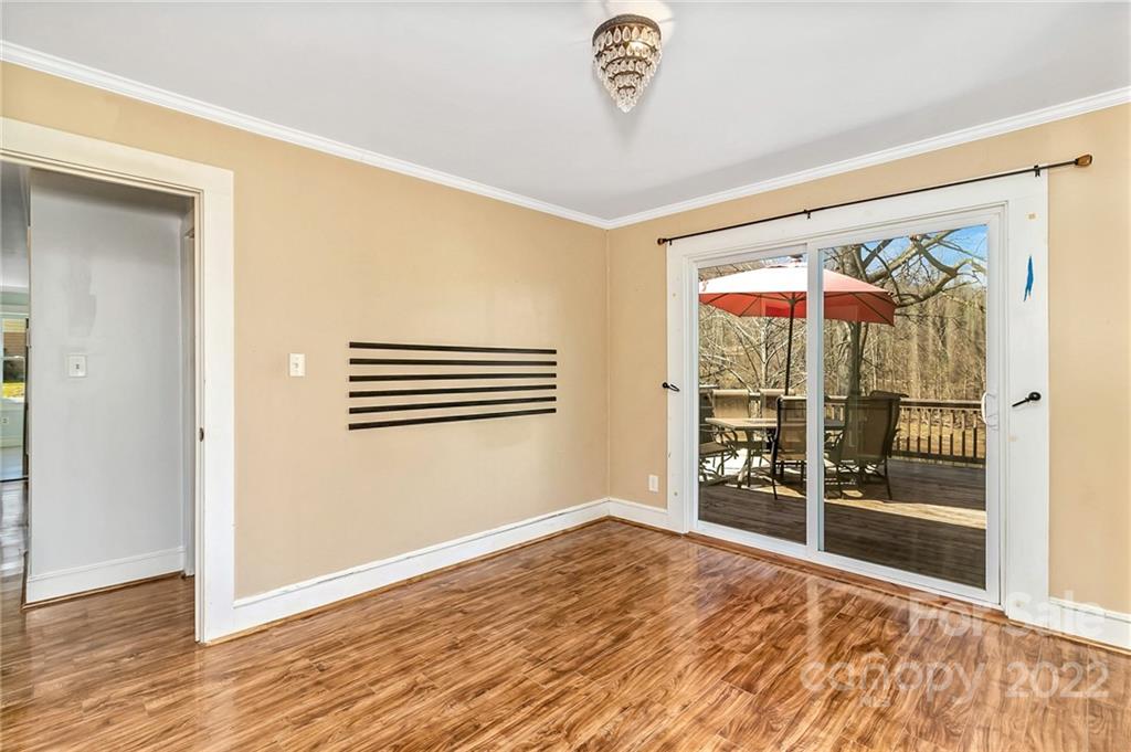 1470 Max Thompson Road Canton, NC 28716 - Photo 25 of 35 an empty room with wooden floor and windows
