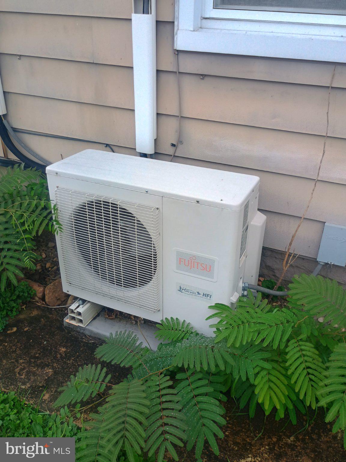 306 Ridgley Street Orbisonia, PA 17243 - Photo 21 of 21 Cooling unit nestled in greenery.