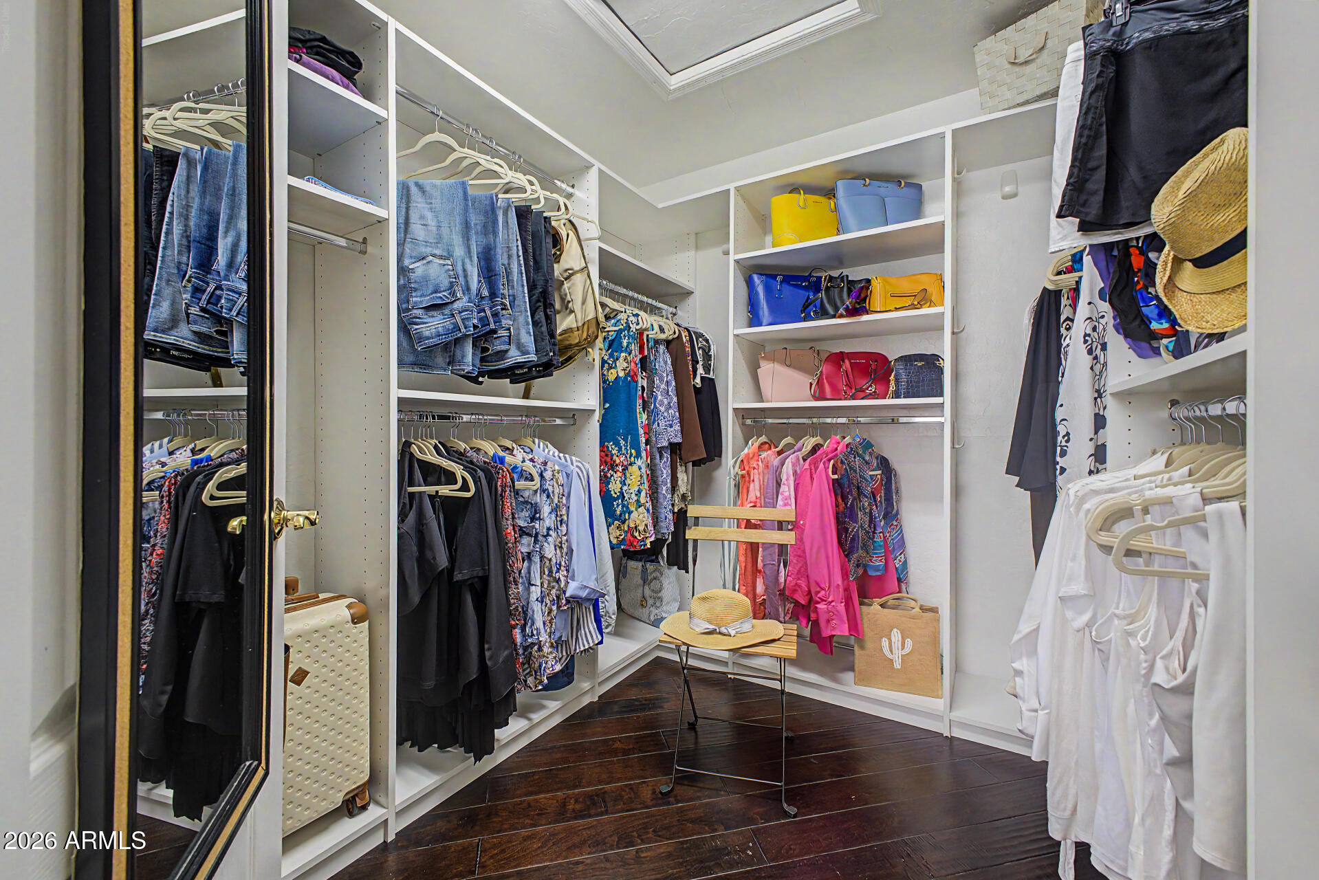 1632 West Frye Road Phoenix, AZ 85045 - Photo 14 of 37 a view of walk in closet with clothes