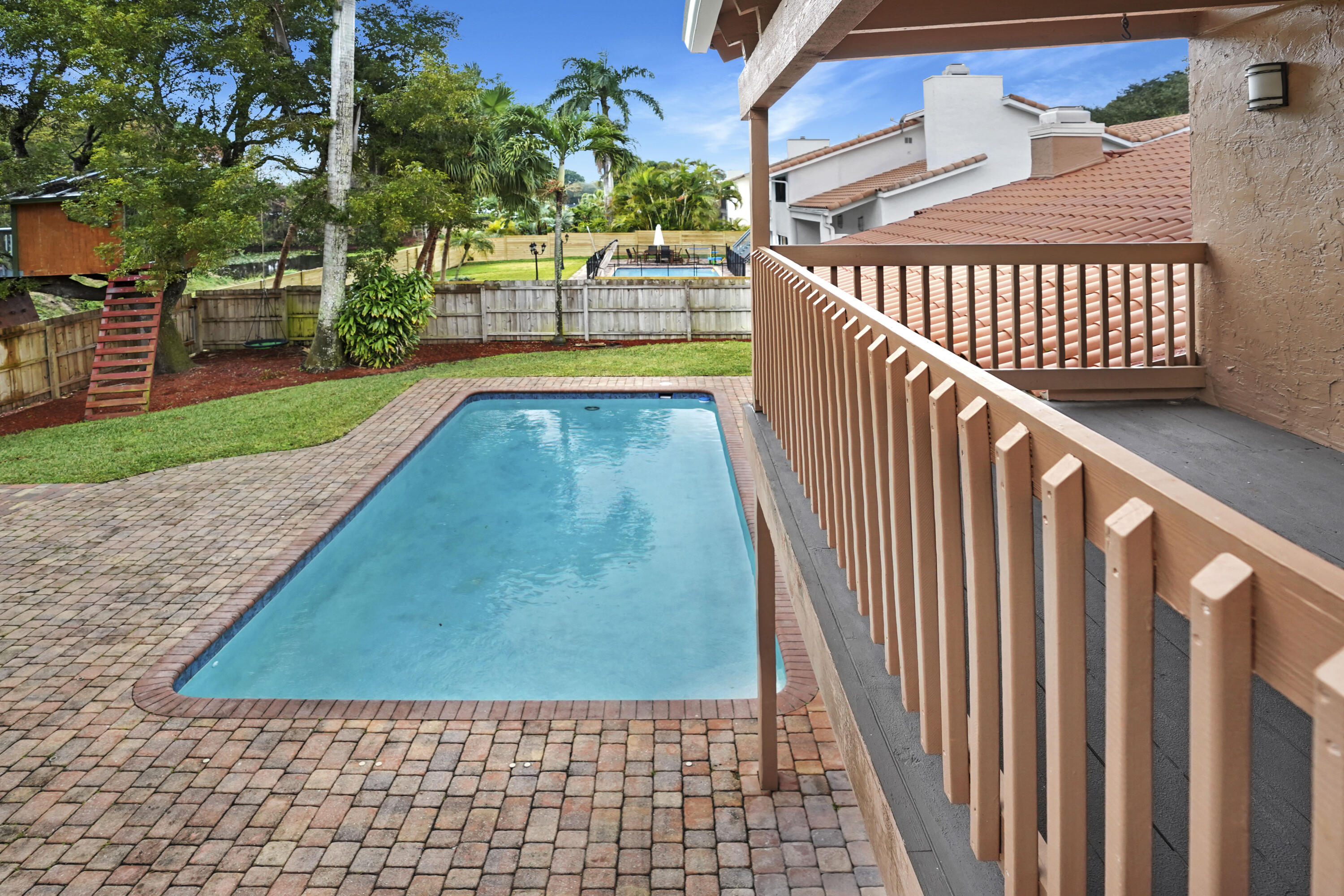 2674 Northwest 41st Street Boca Raton, FL 33434 - Photo 38 of 48 a view of a backyard with a deck