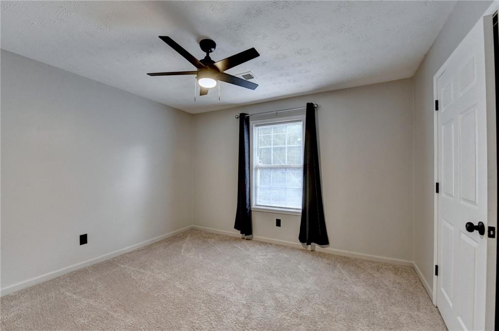 801 Davis Street Monroe, GA 30655 - Photo 19 of 33 an empty room with closet and windows