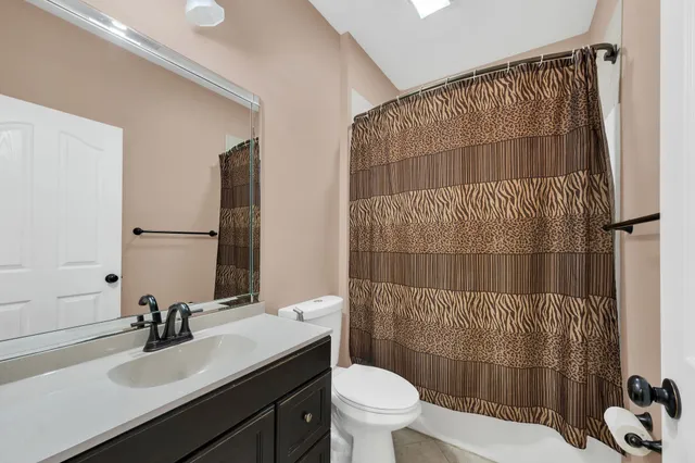 a view of a room with cabinets and stairs