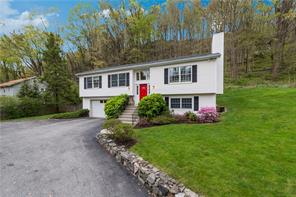 208 Pound Ridge Road Bedford, NY 10506 - Photo 1 of 1 a front view of a house with a garden