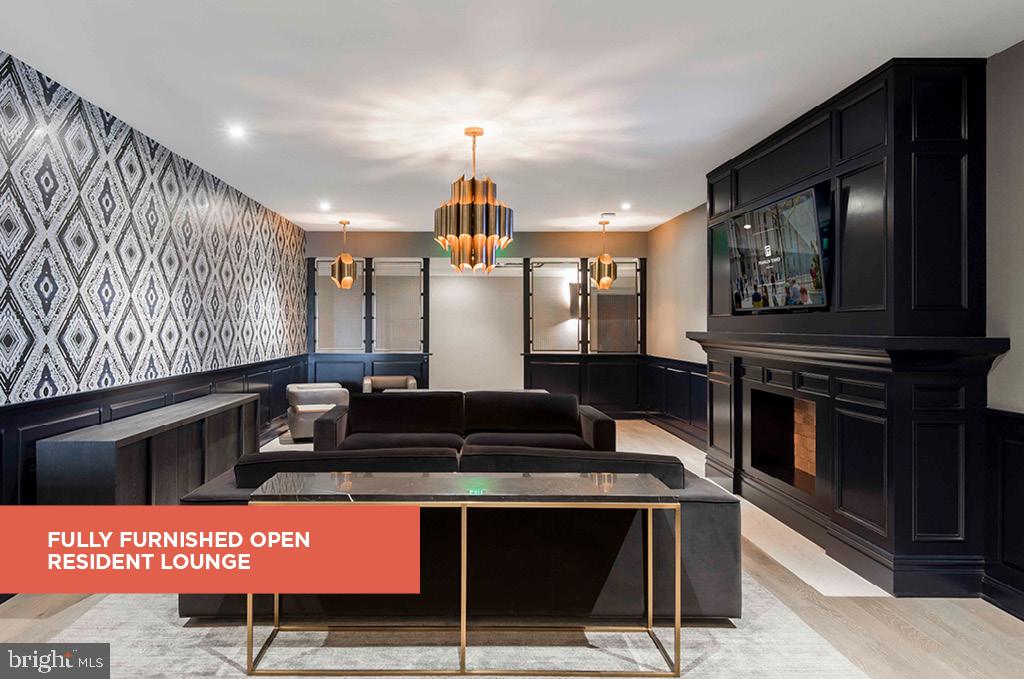 200 North 16th Street, Unit 2111 Philadelphia, PA 19102 - Photo 21 of 66 a kitchen with stainless steel appliances kitchen island granite countertop a stove a sink and a microwave