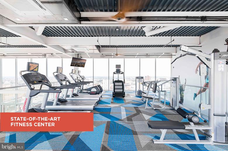 200 North 16th Street, Unit 2111 Philadelphia, PA 19102 - Photo 26 of 66 a view of a living room with furniture and floor to ceiling windows