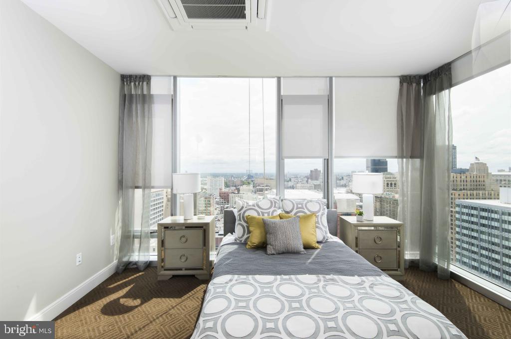 200 North 16th Street, Unit 2111 Philadelphia, PA 19102 - Photo 59 of 66 a living room with furniture and a floor to ceiling window