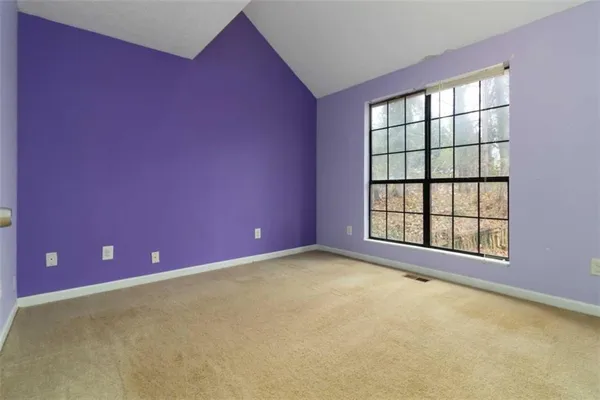 a view of empty room with windows