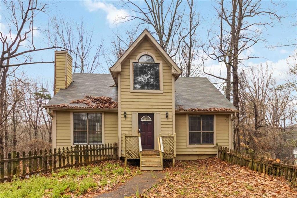 5552 Little Mill Road Buford, GA 30518 - Photo 2 of 30 a front view of a house with a garden