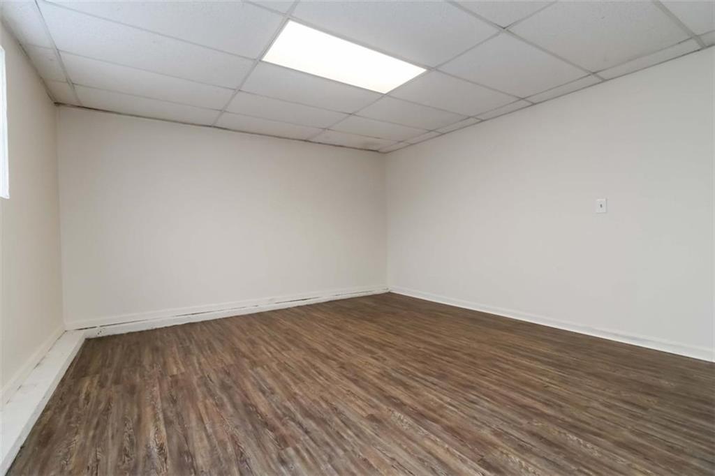 5552 Little Mill Road Buford, GA 30518 - Photo 29 of 30 a view of an empty room and wooden floor