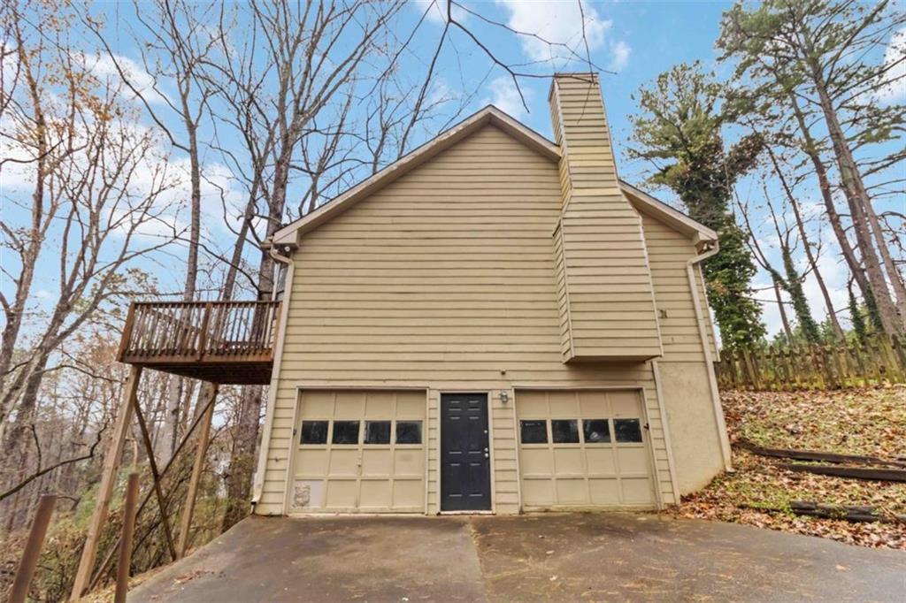5552 Little Mill Road Buford, GA 30518 - Photo 6 of 30 a view of a white house with a large tree