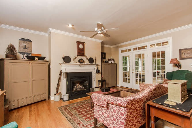 7701 Wilderness Road Raleigh, NC 27613 - Photo 5 of 25 Family Room with gas-log fireplace open to Breakfast Room, Kitchen Family Room
