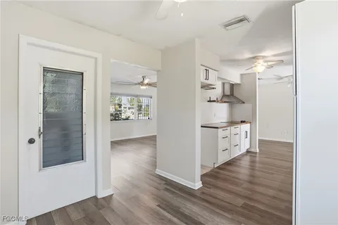 a view of kitchen with wooden floor