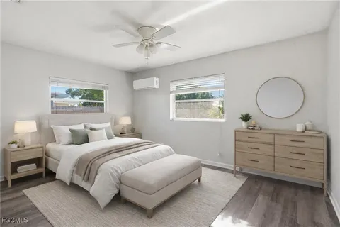 a bedroom with a large bed and a dresser