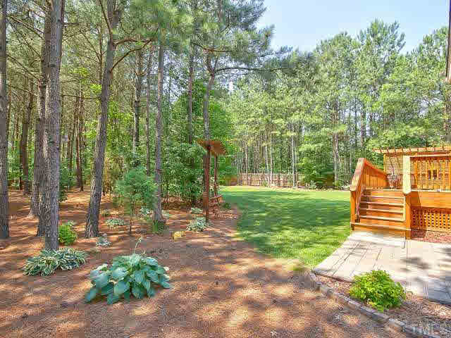 9705 Bailey Grove Court Raleigh, NC 27613 - Photo 22 of 25 Grilling patio is located just off the wood deck and is the perfect spot for a summer bbq