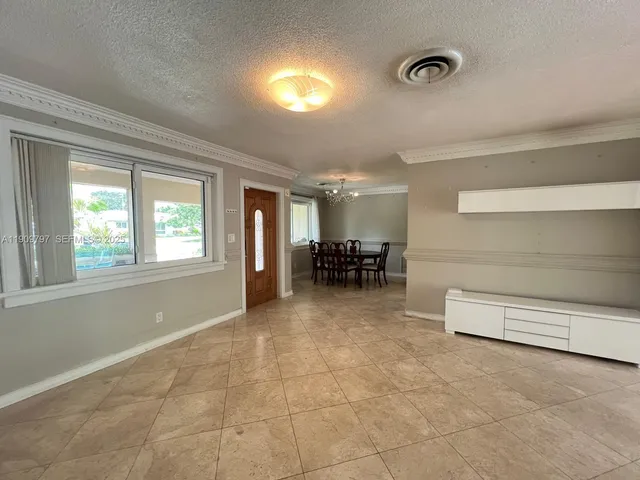 a view of livingroom with furniture and windows