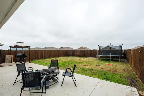 an outdoor space with furniture and a garden