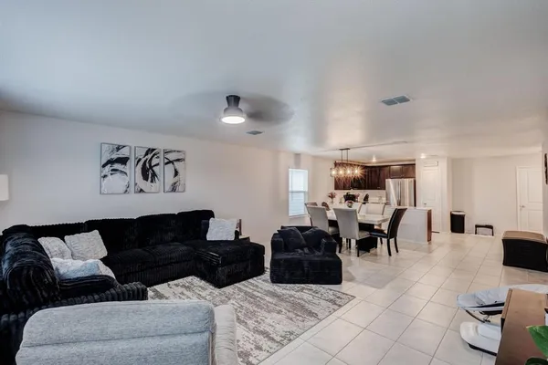 a living room with furniture and view of couch
