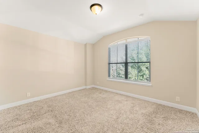 an empty room with a empty space and windows